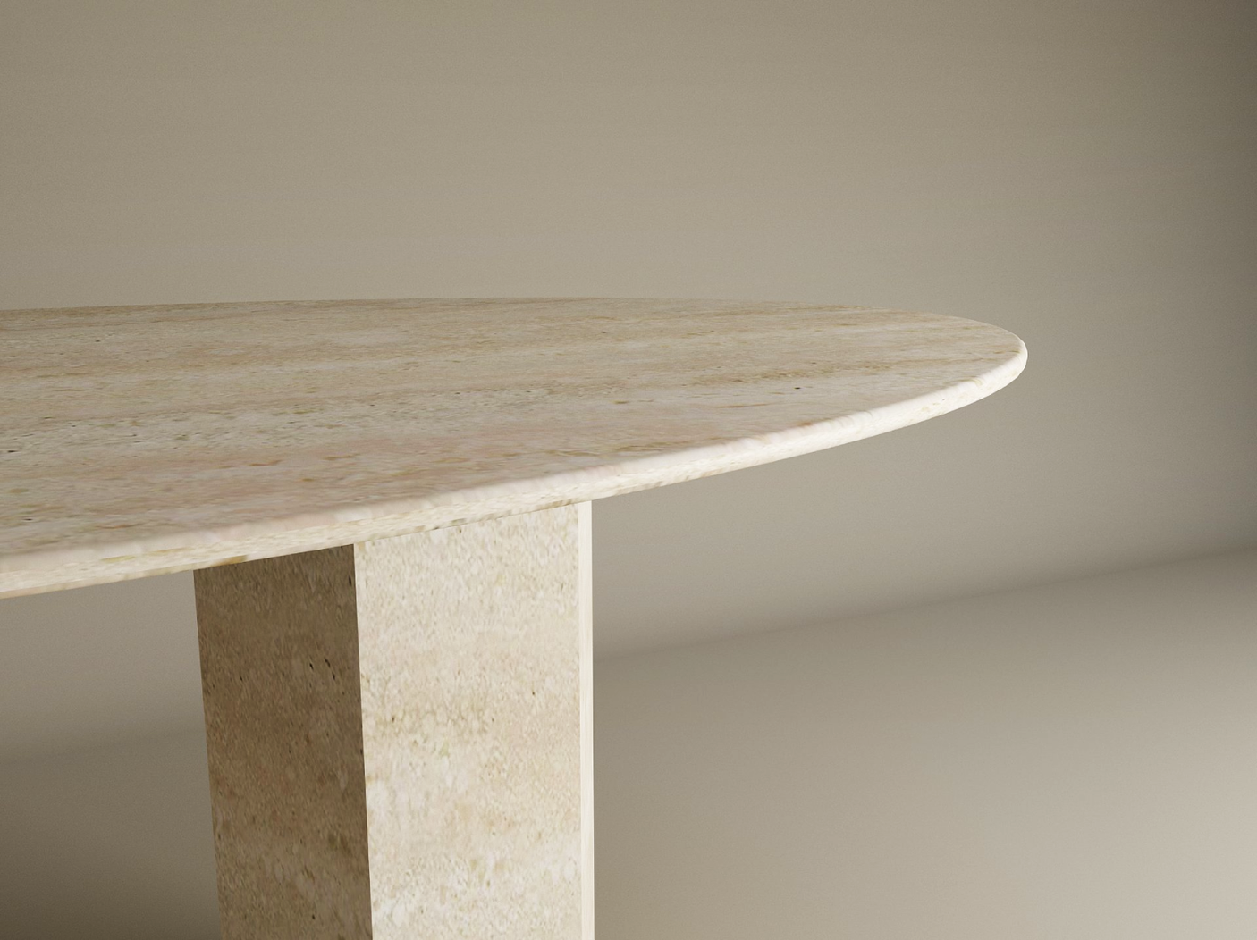 A close-up of the TRAVERTABLE Ellips Travertine Dining Table shows its organic hexagonal stone pedestal base and beige natural stone tabletop—an elegant, customizable heirloom piece for any space, set against a softly lit neutral background.