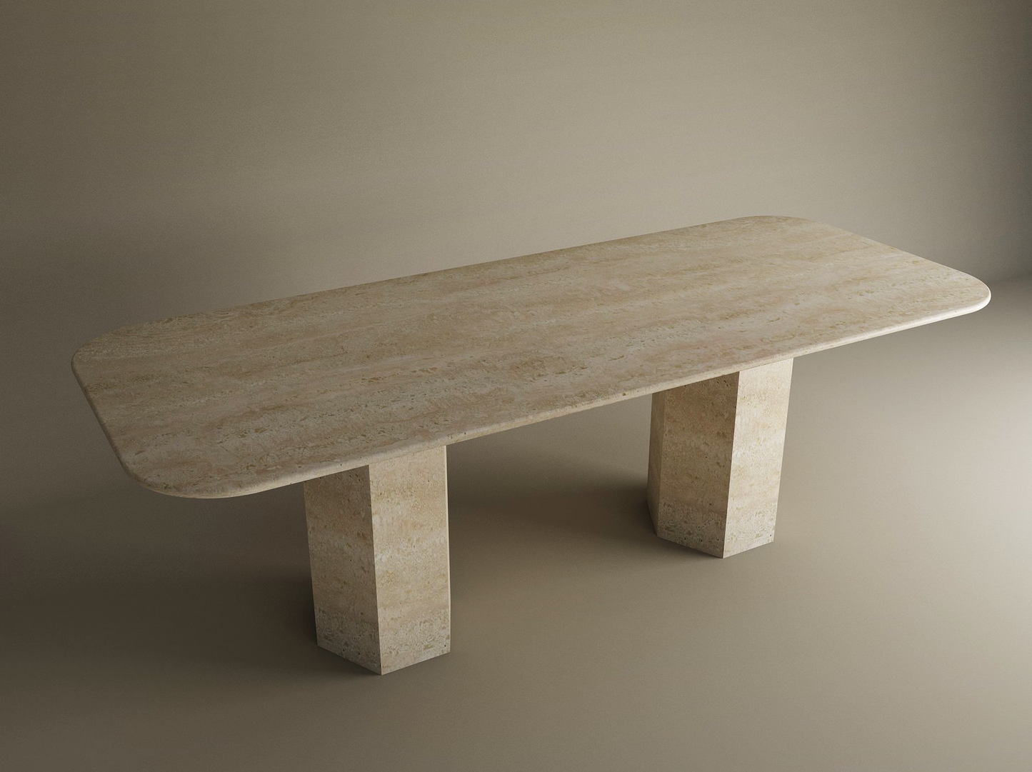 The TRAVERTABLE Rectangular Travertine Dining Table features a customizable beige stone top with rounded corners and two hexagonal pedestal bases, set against a neutral backdrop.