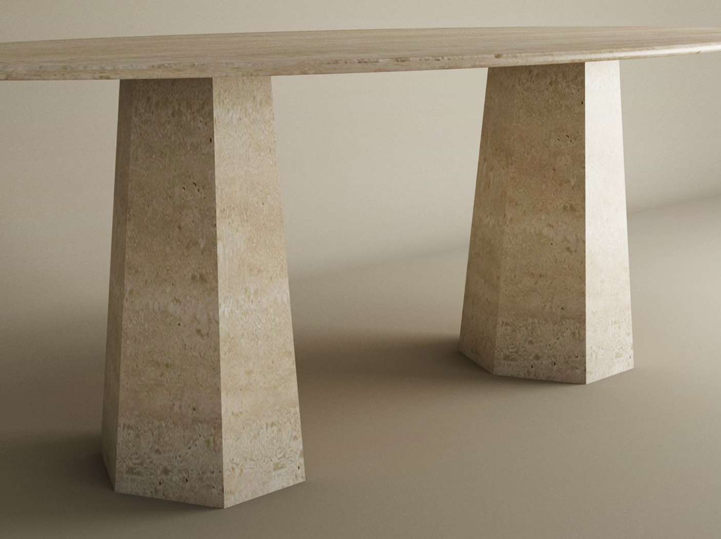 A close-up of the TRAVERTABLE Ellips Travertine Dining Table features its customizable solid travertine stone top and tapered round base, showcasing a neutral palette ideal as an heirloom piece for any space.