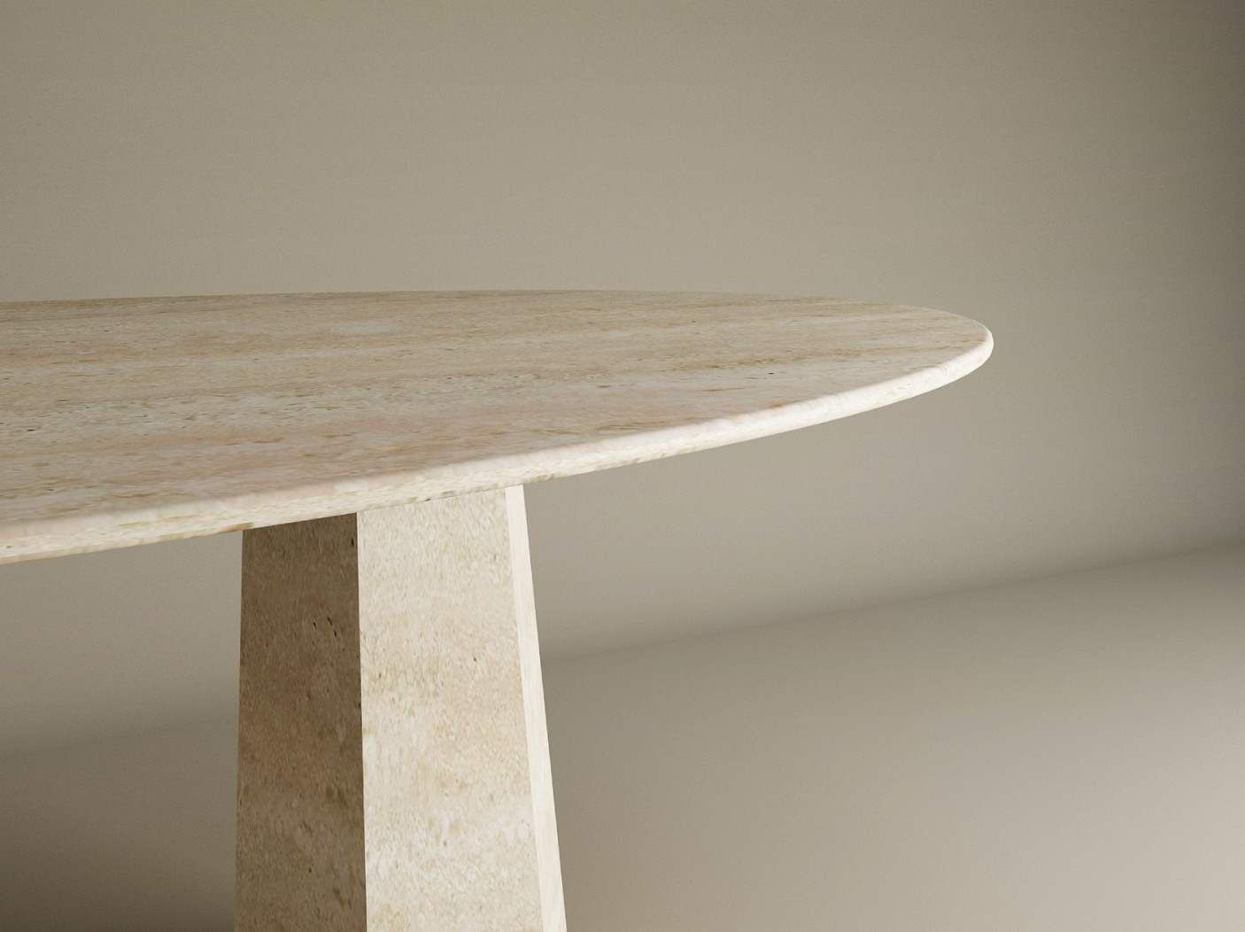 A close-up shows the TRAVERTABLE Ellips Travertine Dining Table with a beige, oval travertine tabletop and a solid, tapered round stone base against a plain, light background. Table is customizable.