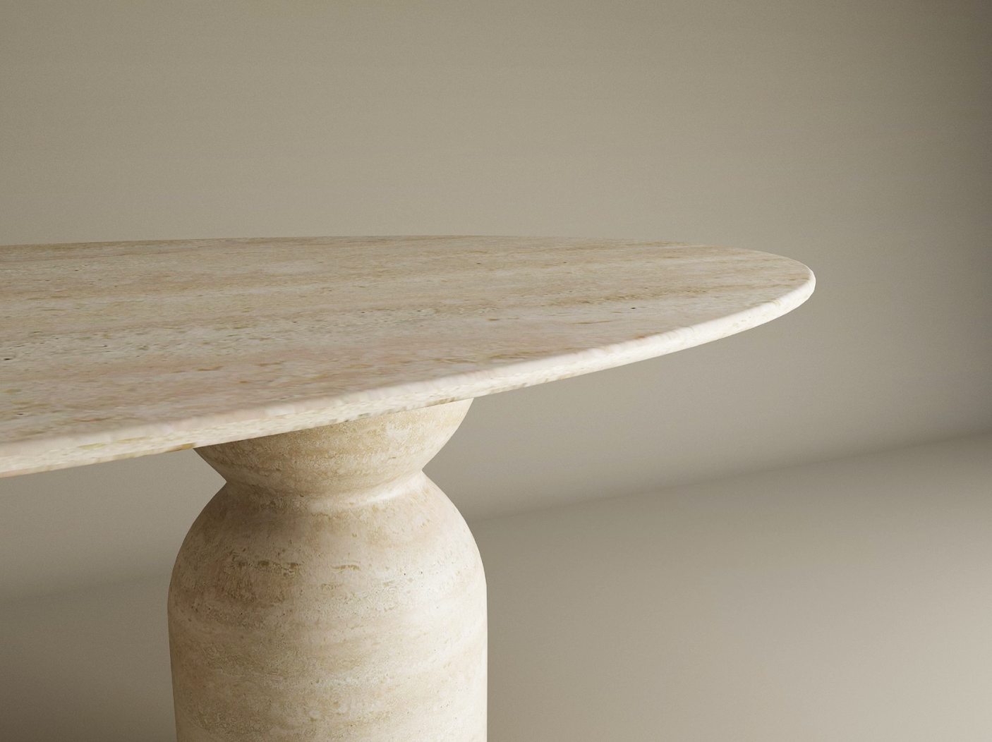 A close-up of the TRAVERTABLE Ellips Travertine Dining Table features a smooth, round natural stone top and a sculptural organic travertine base, set against a plain light background. Customization options available.
