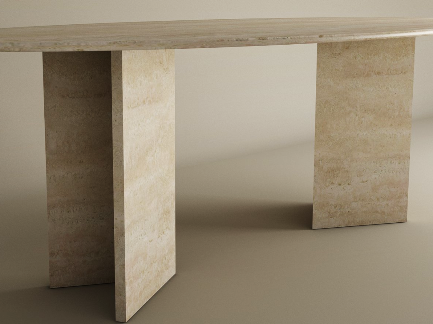 The TRAVERTABLE Ellips Travertine Dining Table features a thick, oval natural stone top and a split-V travertine base in beige. The modern table is customizable and set against a plain, neutral background.