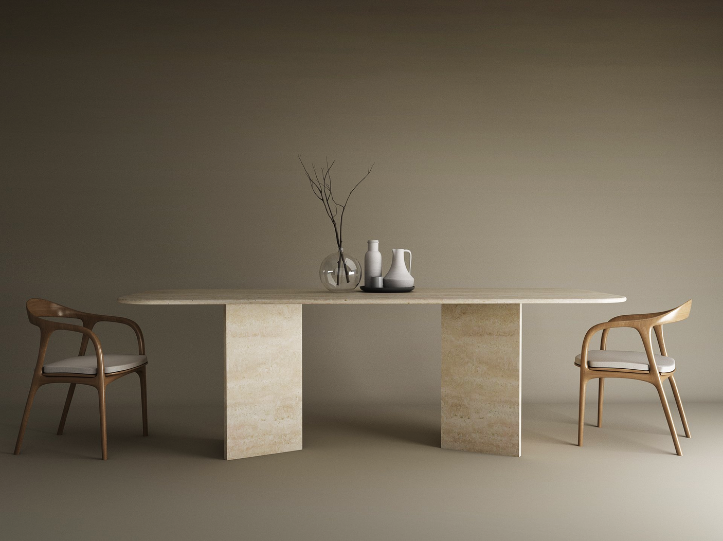 A minimalist scene features the TRAVERTABLE Rectangular Travertine Dining Table with Split-V Pedestal Base, two modern wooden chairs with white cushions, and vases plus a glass bowl centerpiece, set against a plain brown background.