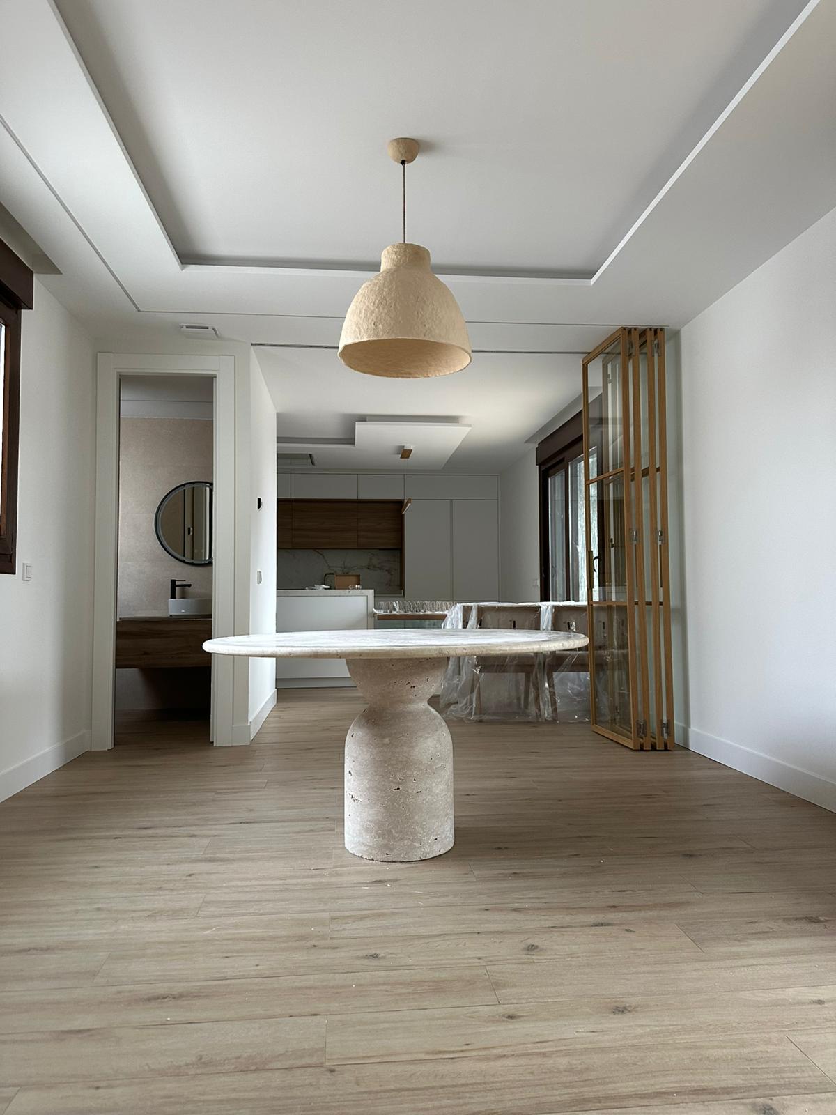 Round Travertine Dining Table with Sculptural Round Center Base