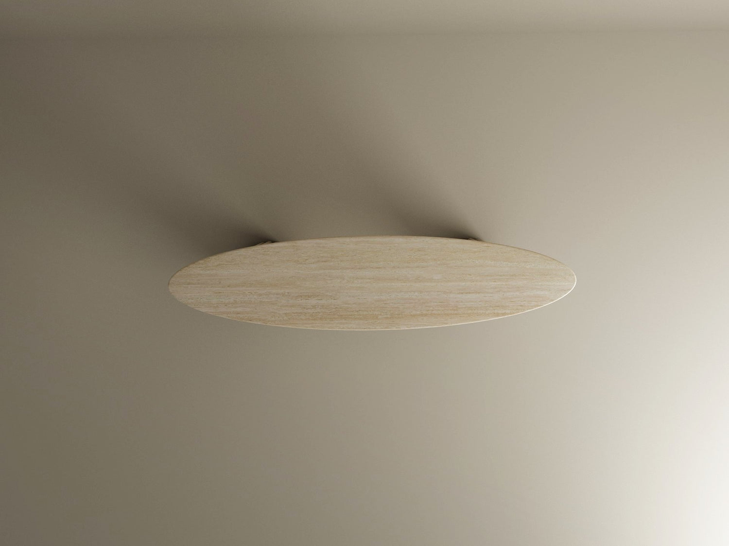 The Ellips Travertine Console Table by TRAVERTABLE features a sculptural travertine stone base and rectangular pedestal. Its modern, linear design stands out against a beige backdrop, casting soft shadows for an elegant touch. Customizable to fit your space.