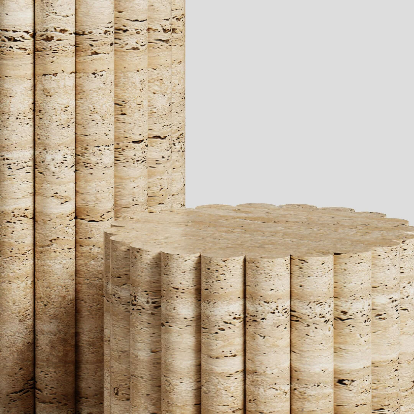 The Travertine Elegance Pillar Trio by Travertable features two vertical beige columns resembling cork, complemented by a matching cylindrical piece. Their sculptural design showcases earthy grooves and patterns against a light gray background.