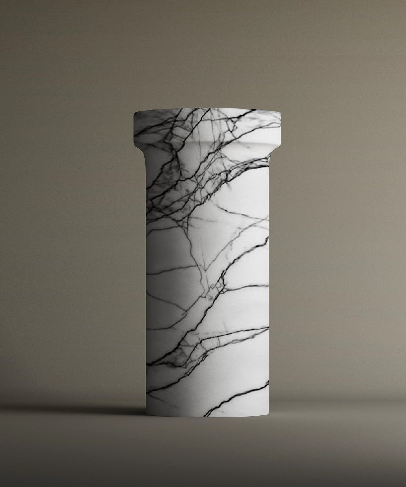 The Lilac Marble Pedestal Vanity Sink by TRAVERTABLE features striking black veining on a tall, freestanding white marble column with a simple capital, set against a neutral background.