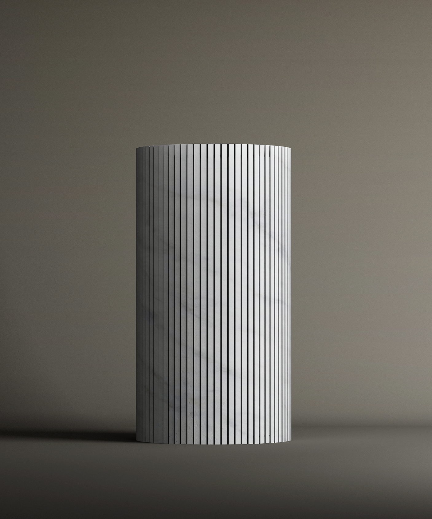 The TRAVERTABLE Carrara Round Fluted Marble Pedestal Vanity Sink features a smooth, white cylindrical surface with vertical grooves. Its fluted carving and soft lighting highlight the sinks timeless design against a neutral background.