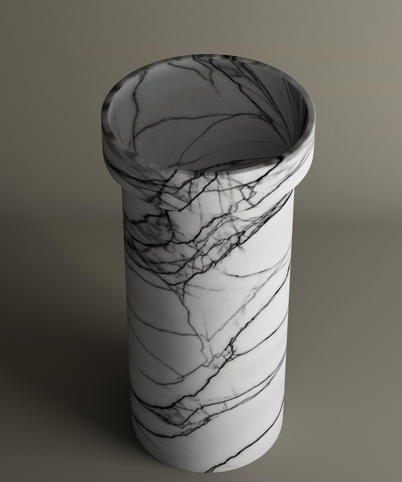 The TRAVERTABLE Lilac Marble Pedestal Vanity Sink displays a striking black-veined white surface with a wide, rounded opening, standing freestanding against a neutral backdrop.