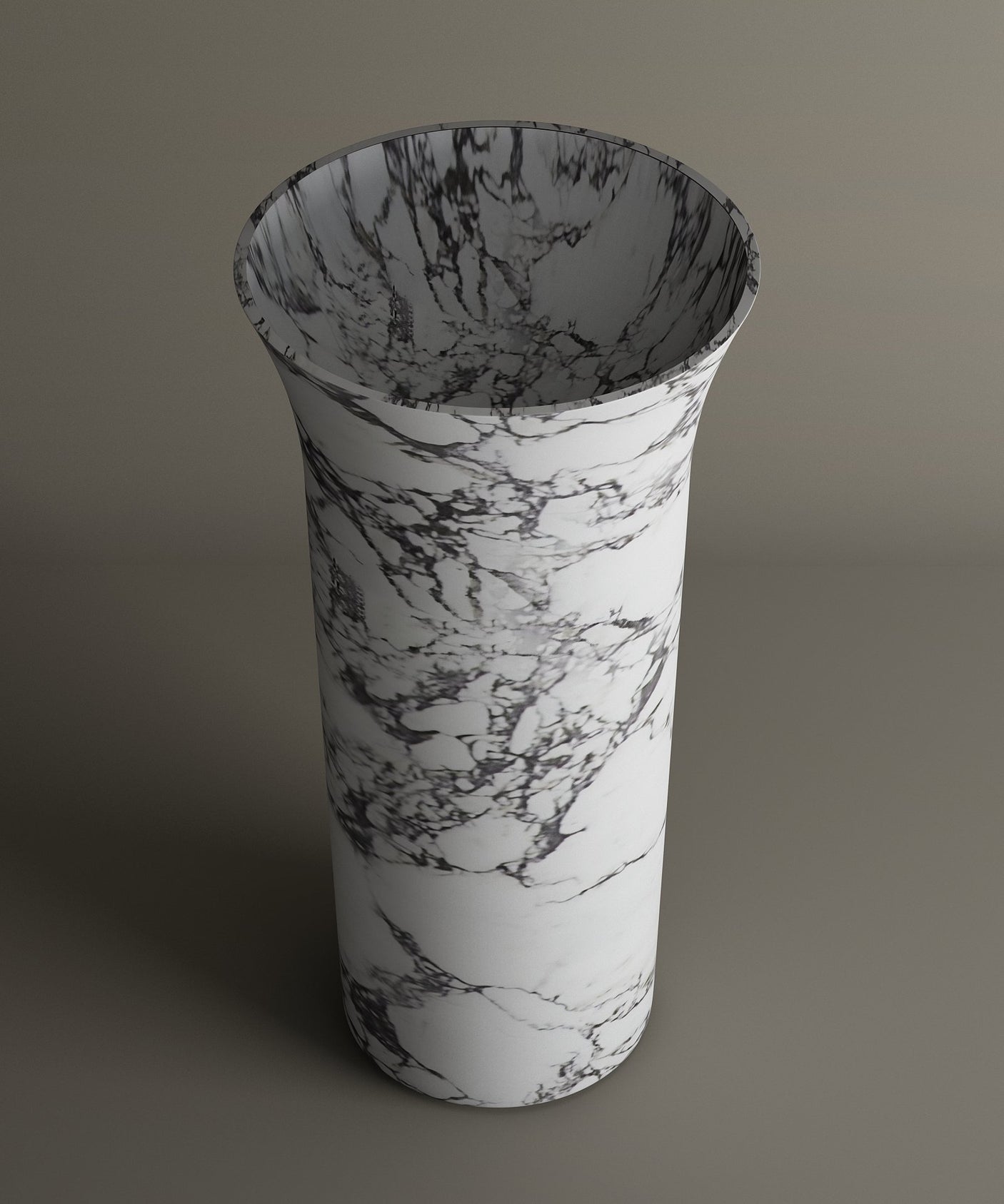 The TRAVERTABLE Calacatta Marble Cylinder Pedestal Vanity Sink features a tall, cylindrical shape with a flared rim and elegant white surface accented by black and gray marble-like veining—an architectural statement for any modern bathroom.