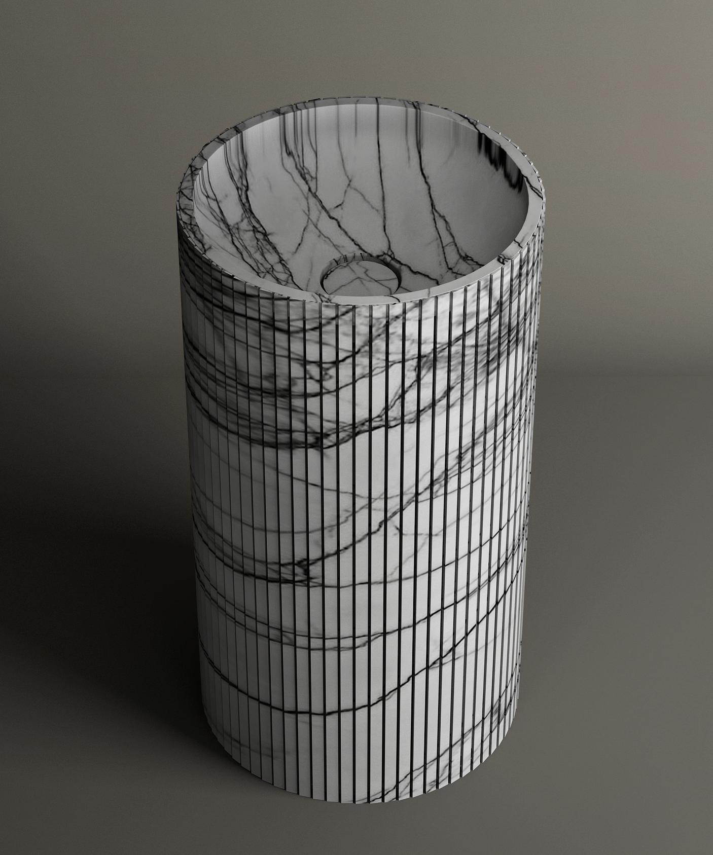 The TRAVERTABLE Lilac Round Fluted Marble Pedestal Vanity Sink, featuring white marble with dark gray veining and sculptural fluting, stands elegantly against a plain gray background.