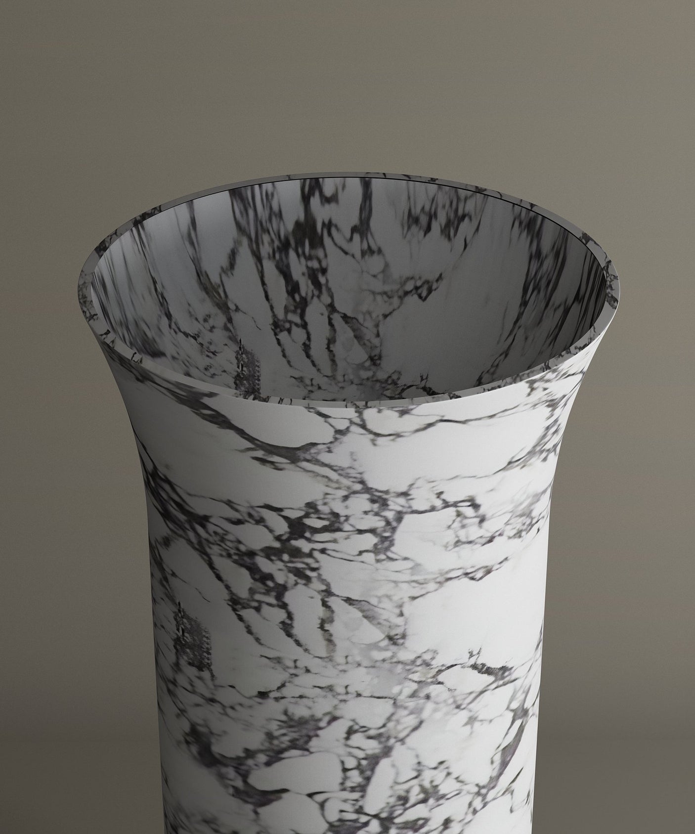 The TRAVERTABLE Calacatta Marble Cylinder Pedestal Vanity Sink features a flared, tall silhouette in white and dark gray marble, with a smooth surface and wide opening, making it an architectural statement for any modern bathroom.