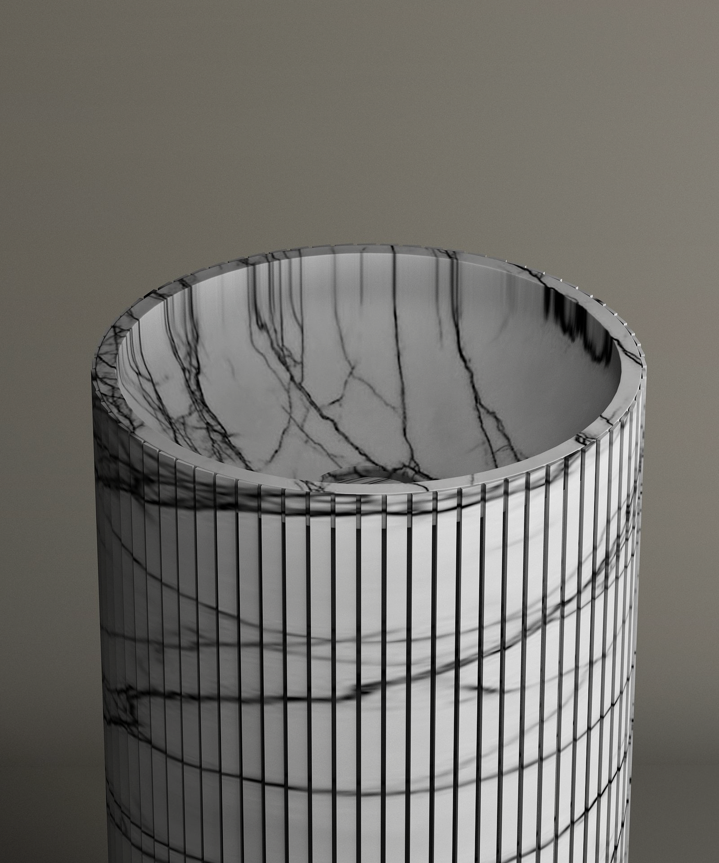 The TRAVERTABLE Lilac Round Fluted Marble Pedestal Vanity Sink features a polished, reflective surface with sculptural fluting and gray veining, beautifully showcasing its natural marble patterns against a neutral background.