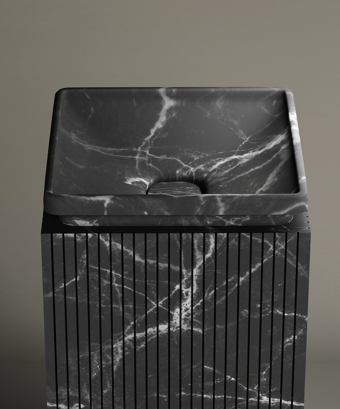 The TRAVERTABLE Nero Marquina Square Marble Pedestal Vanity Sink features black Spanish marble with white veining and vertical-grooved pedestal, set against a plain taupe wall for a striking contemporary bathroom display.