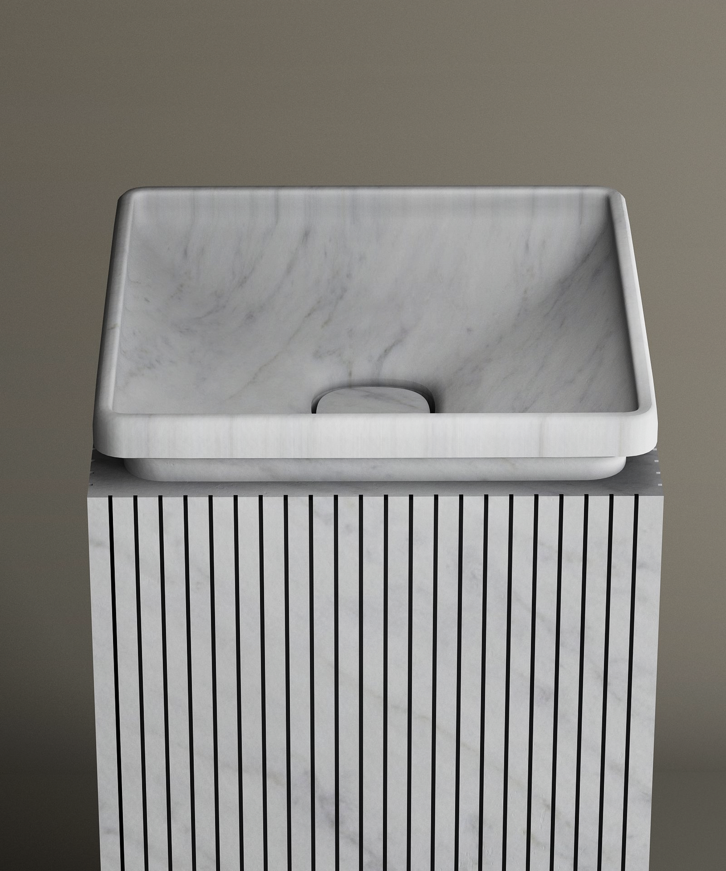 The TRAVERTABLE Carrara Square Marble Pedestal Vanity Sink features a smooth rectangular basin atop a fluted, square pedestal, serving as an elegant centerpiece against a taupe backdrop—ideal for sophisticated interiors.