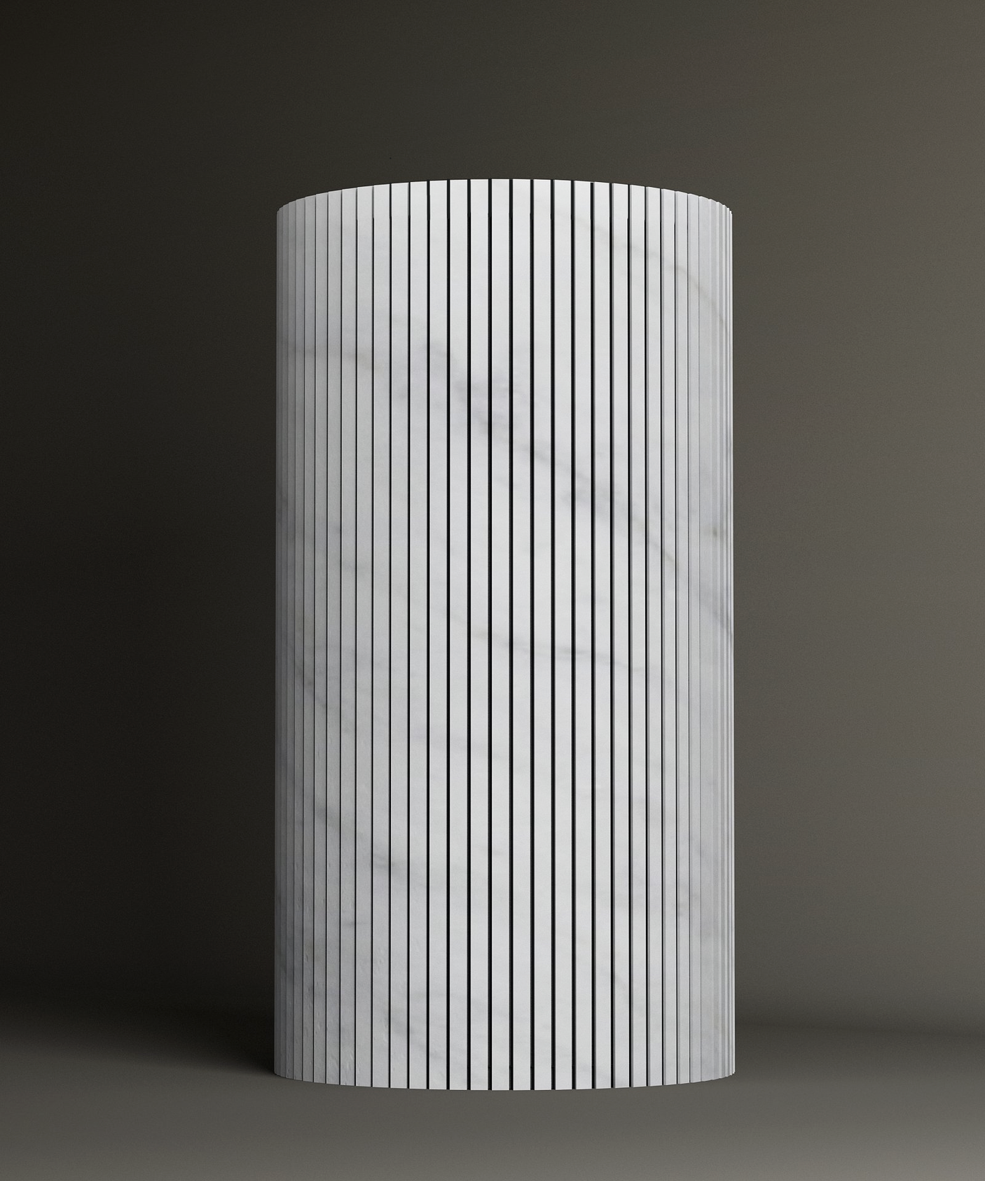 The TRAVERTABLE Carrara Round Fluted Marble Pedestal Vanity Sink features a tall, cylindrical shape with a white Carrara marble finish, vertical black lines, and fluted carving, set against a plain dark background.