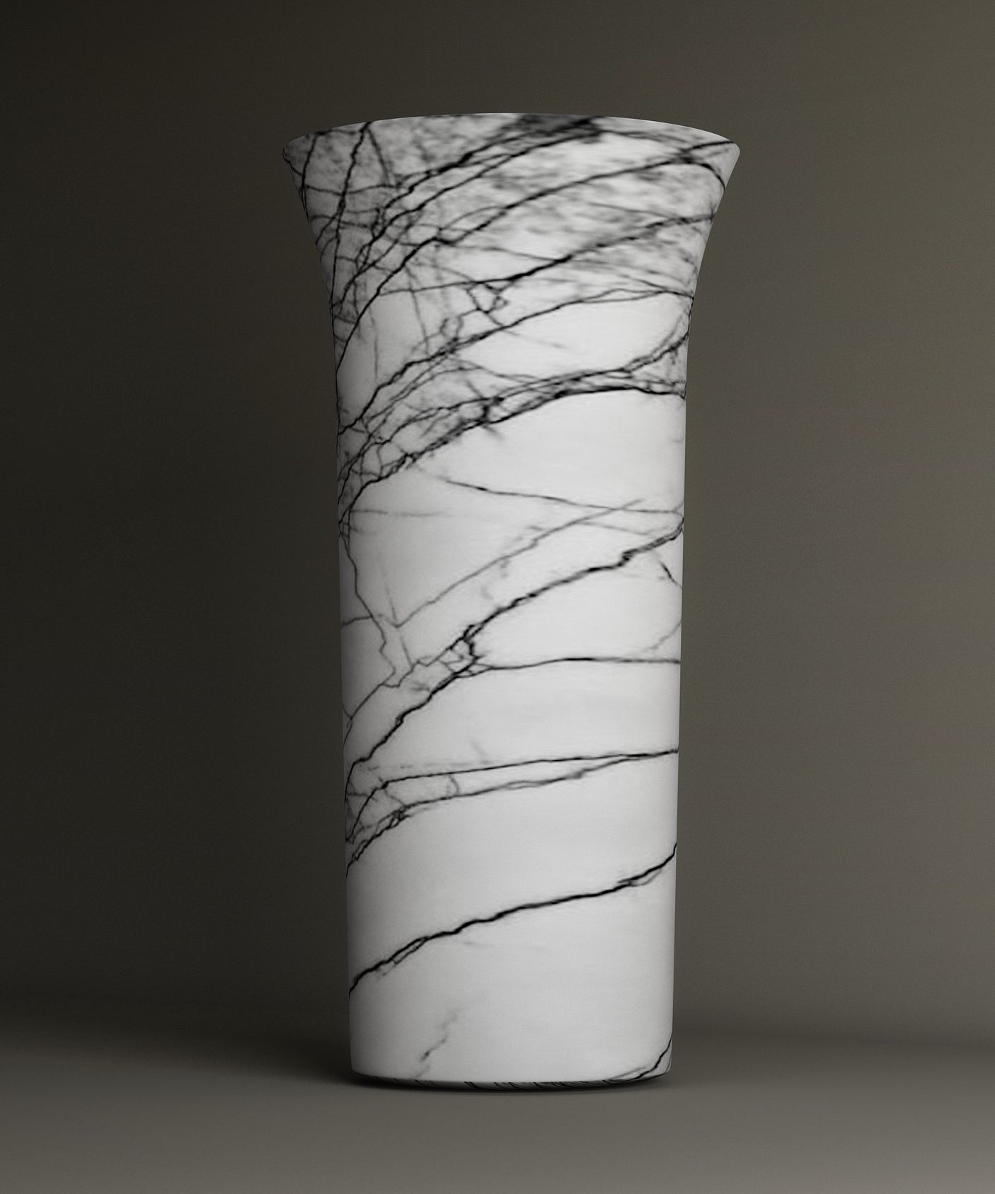 The Lilac Marble Cylinder Pedestal Vanity Sink by TRAVERTABLE showcases a tall white form with a flared rim and striking black veining branching across its smooth surface.