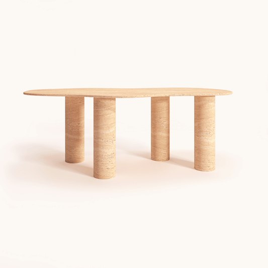 The Cascade Travertine Dining and Meeting Table by Travertable features a minimalist design with an oval light wood top and four cylindrical legs, all set against a plain white background, emphasizing its natural elegance and contemporary style reminiscent of travertine.