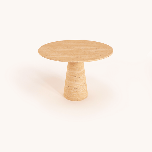 The Elysian Travertine Round Dining Table by Travertable features a cylindrical base and modern design, with a natural light brown finish. Its displayed against a plain white backdrop and can be customized to suit your unique style needs.