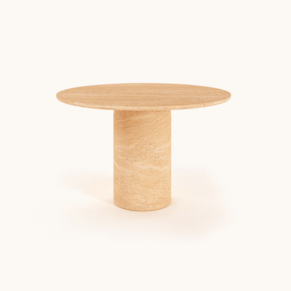 The Chic Oval Travertine Dining Table by Travertable, featuring a smooth surface and cylindrical base, is placed against a plain white background, adding elegance to any space.