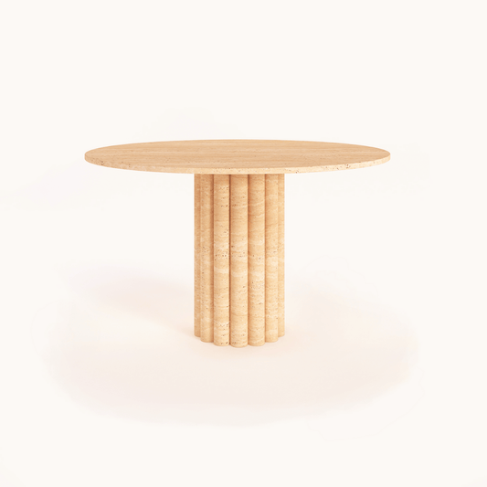 The Classic Round Travertine Dining Table by Travertable combines a smooth top and cylindrical, fluted base for a minimalist design. Its light, natural wood finish complements a plain white background, making it as elegant as any bespoke wooden table.