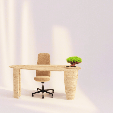 A minimalist office corner showcases Travertables Versatile Travertine Office and Dining Table with Built-in Vase, featuring a beige textured desk and chair on a white background. A small green potted plant enjoys soft natural light, casting gentle shadows.