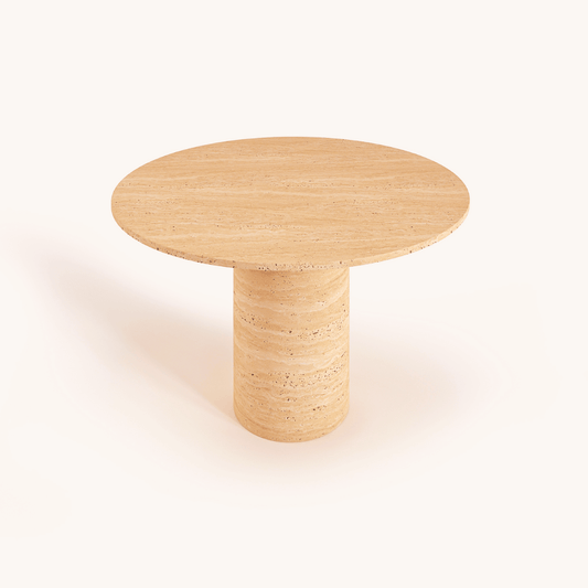 The Elysian Travertine Round Dining Table by Travertable features a customizable design with a smooth wooden surface and cylindrical base, set against a plain white background.