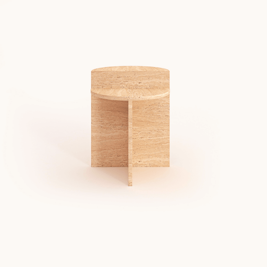 The Travertable Contemporary Travertine Side Table features a minimalist round design in light-colored wood with a smooth finish, geometric shapes, and cross-shaped support, all highlighted against a plain white backdrop. Ideal for modern living spaces.