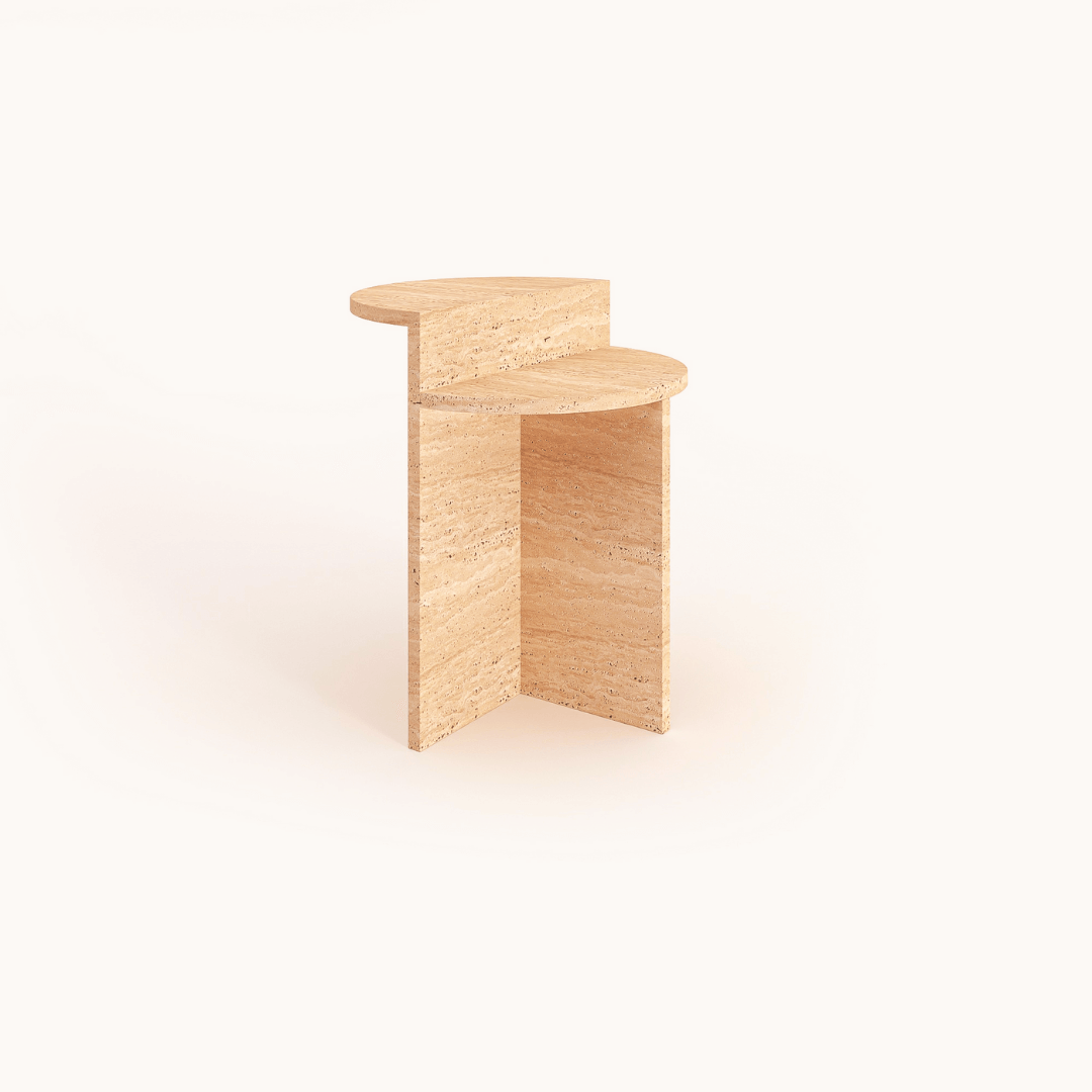 A minimalist wooden side table with a unique geometric design and an L-shaped base paired with an overlapping semi-circular top. Its light, natural finish mirrors the elegance of the “Contemporary Travertine Side Table” by Travertable, perfect for modern living spaces.