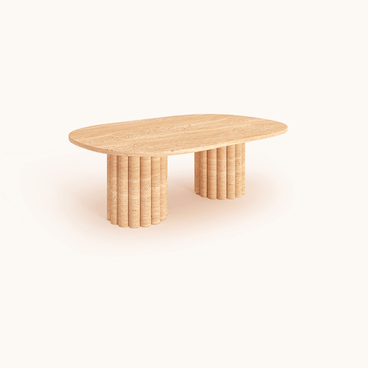 The Handcrafted Italian Travertine Coffee Table by Travertable features expert craftsmanship, with a smooth oval top and two wide cylindrical bases of stacked circular segments, set against a plain light background.