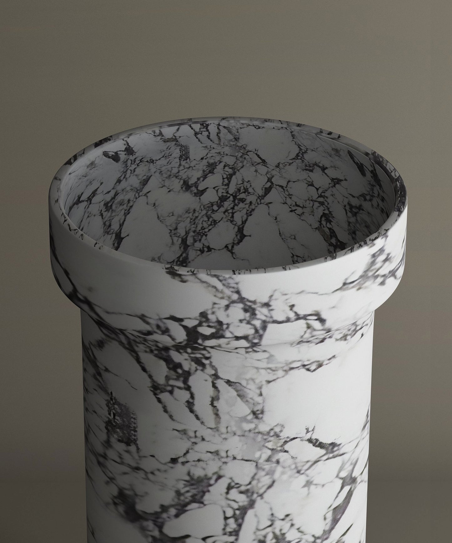 The TRAVERTABLE Calacatta Marble Pedestal Vanity Sink features striking dark gray veining on white marble, offering timeless elegance against a neutral backdrop.