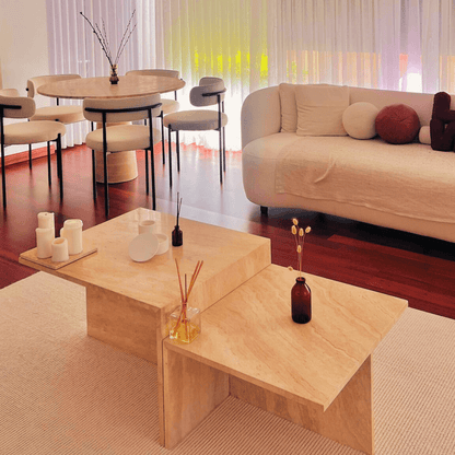 travertine coffee table in customer home. travertine dining table in the background