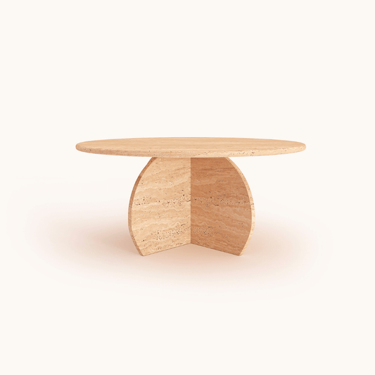 The Stone Essence Travertine Coffee Table by Travertable features a round, light brown wooden tabletop presenting timeless design and natural beauty. Its cross-shaped base maintains a wood texture, offering a monolithic modern design set against a white background.