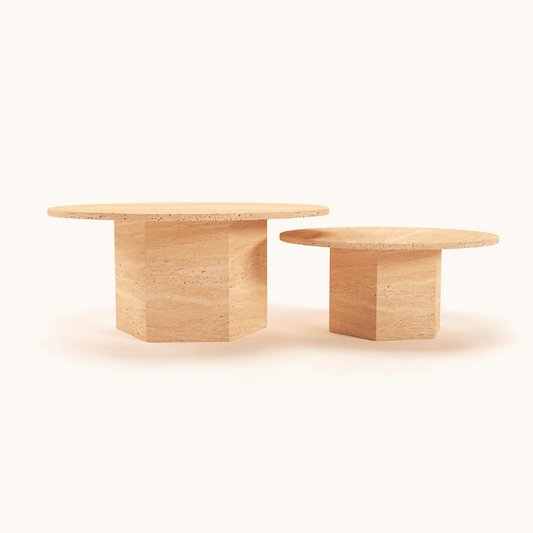 Two round wooden tables with thick, rectangular bases exude timeless design, with one slightly taller than the other. Their natural finish highlights the wood grain patterns, reminiscent of the Travertable Desert Serenity Travertine Coffee Tables earthy elegance, all set against a plain white background.