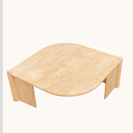 The Travertable Grace Coffee Table features a beige, marble-like travertine surface with rounded edges and sturdy legs. Its smooth, polished finish and modern minimalist design embody timeless elegance, making it perfect for any setting.