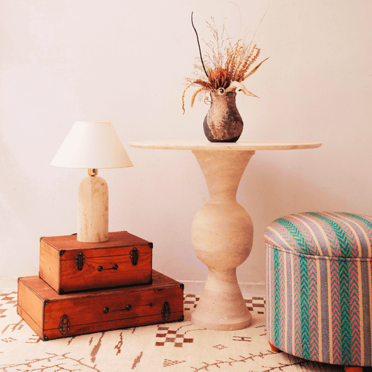 The Hourglass Round Travertine Dining Table