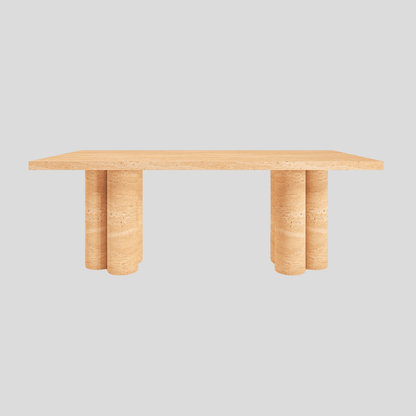 The Meridian Travertine Dining Table by Travertable features a rectangular wooden top with two cylindrical solid legs, exuding natural elegance. Its modern design stands out beautifully against a plain gray background.