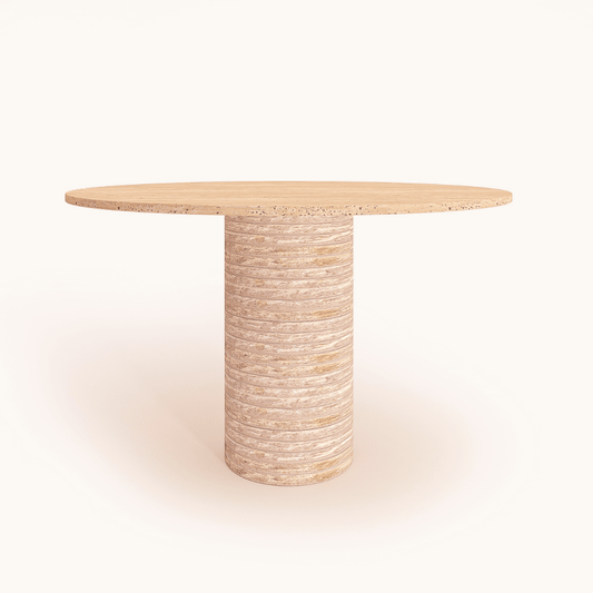 The Rustic Round Travertine Dining Table by Travertable features a smooth, light wooden top on a rustic travertine base made of stacked rings, elegantly contrasting with a plain white background.