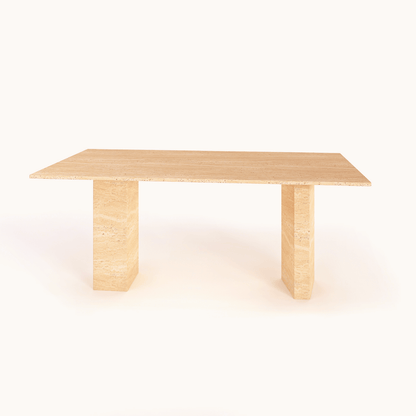 The Regal Rectangular Travertine Dining Table by Travertable exudes natural elegance with its minimalist design and smooth light wood finish. It features two sturdy vertical legs supporting the tabletop, creating a chic, modern look accentuated by a plain white background.
