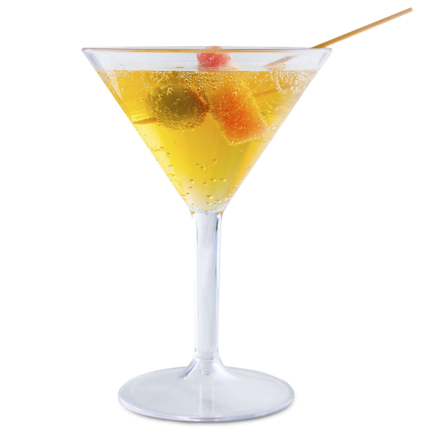 A Mamaco Home Large Martini Glass in unbreakable polycarbonate features a fizzy golden drink with green and orange gummy bears on a skewer. Set against a plain white background, this BPA-free, reusable scene highlights elegance and durability.