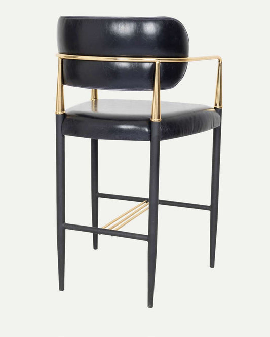 Lux Royale Bar Stool Indulge in the epitome of luxury and elegance with the Lux Royale Bar Stool. This sophisticated stool is crafted with a striking combination of black leather and gleaming gold accents, designed to bring a touch of opulence to any bar