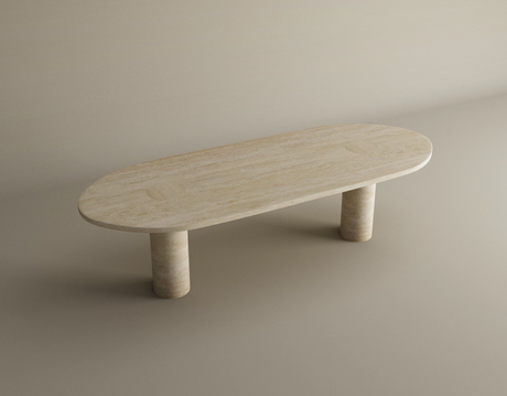 The TRAVERTABLE Oval Travertine Coffee Table features a light beige stone top with warm veining, smooth surface, and two solid cylindrical bases. This customizable coffee table combines minimalist design with natural stone beauty.
