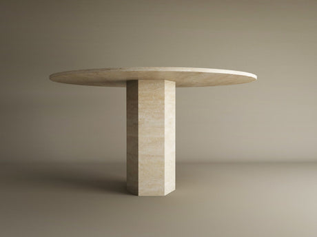 The TRAVERTABLE Oval Travertine Dining Table features a beige stone top and a thick hexagonal center base, highlighting geometric craftsmanship, set against a plain light brown background. Customizable for your dining space.