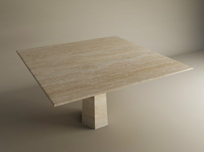 The TRAVERTABLE Square Travertine Dining Table features a natural stone top and a rockcone pedestal base, showcased against a neutral background. Customizable design from the brands Travertine Pedestal collection.