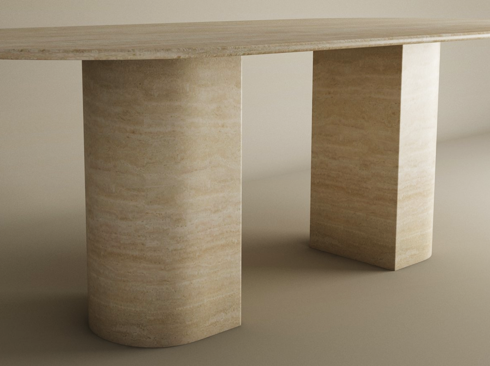 The TRAVERTABLE Oval Travertine Dining Table features a natural stone top and sloped pedestal base. Its smooth, minimalist design and customizable options make this modern heirloom piece a standout in any neutral setting.