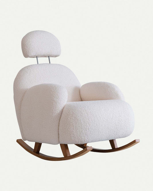 The Cloud Plush Rocking Chair and Ottoman by Travertable features a modern white design with wooden rockers, curved cushioned elegance, an attached headrest via metal rods, ergonomic armrests, and soft textured upholstery for a cozy and stylish appearance.