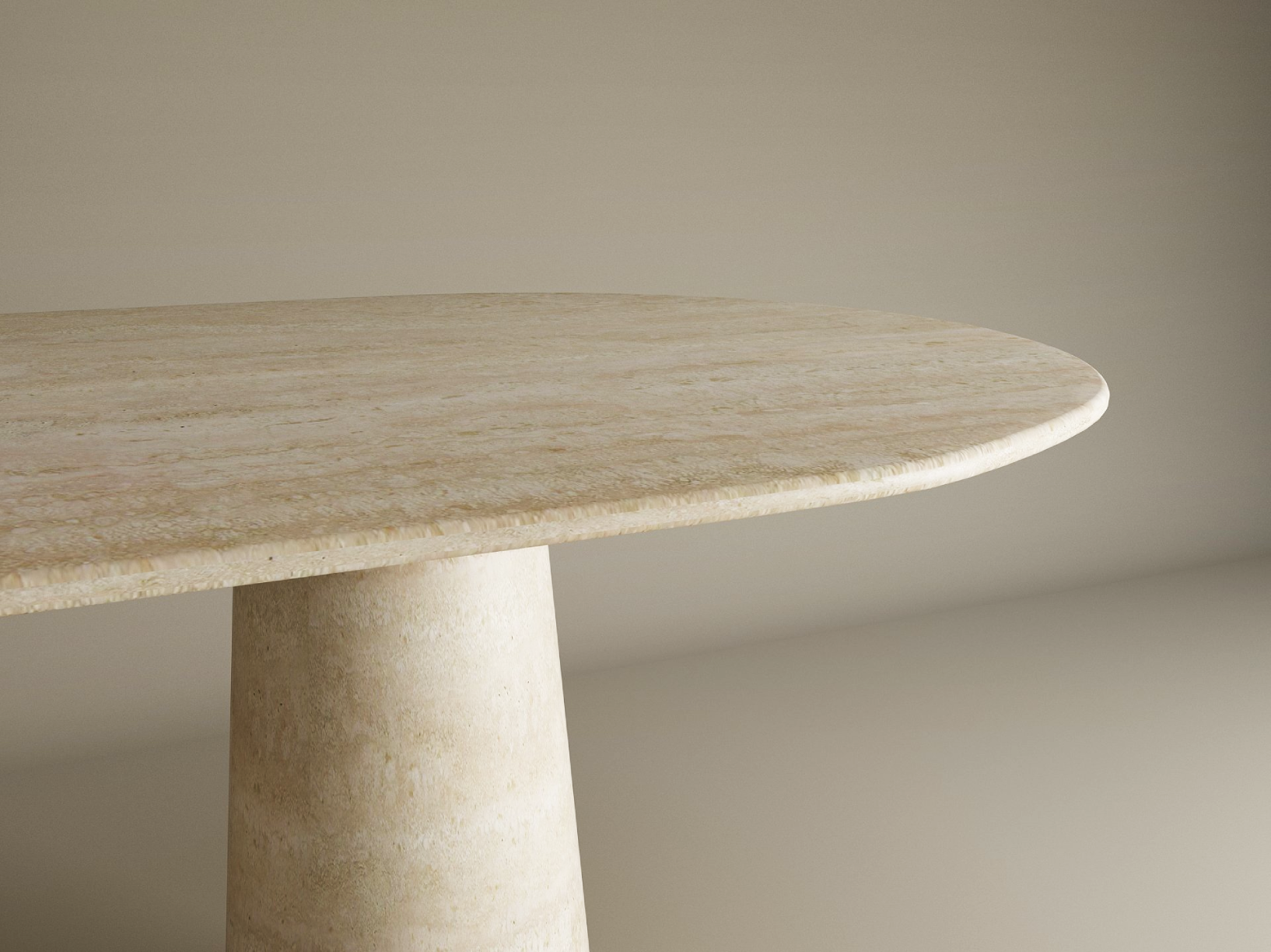 A close-up of the TRAVERTABLE Oval Travertine Dining Table, featuring an organic travertine stone tabletop and a conical pedestal base, shown against a neutral background. Customizable to suit your dining needs.