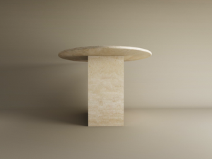 The TRAVERTABLE Ellips Travertine Dining Table with Block Base features a natural stone top and solid base, offering a customizable, minimalist design—an elegant heirloom piece to elevate any dining space.