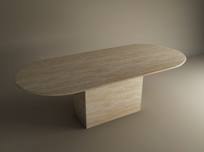 The TRAVERTABLE Oval Travertine Dining Table with Block Base features a natural stone tabletop and customizable design—a timeless heirloom set against a neutral background.