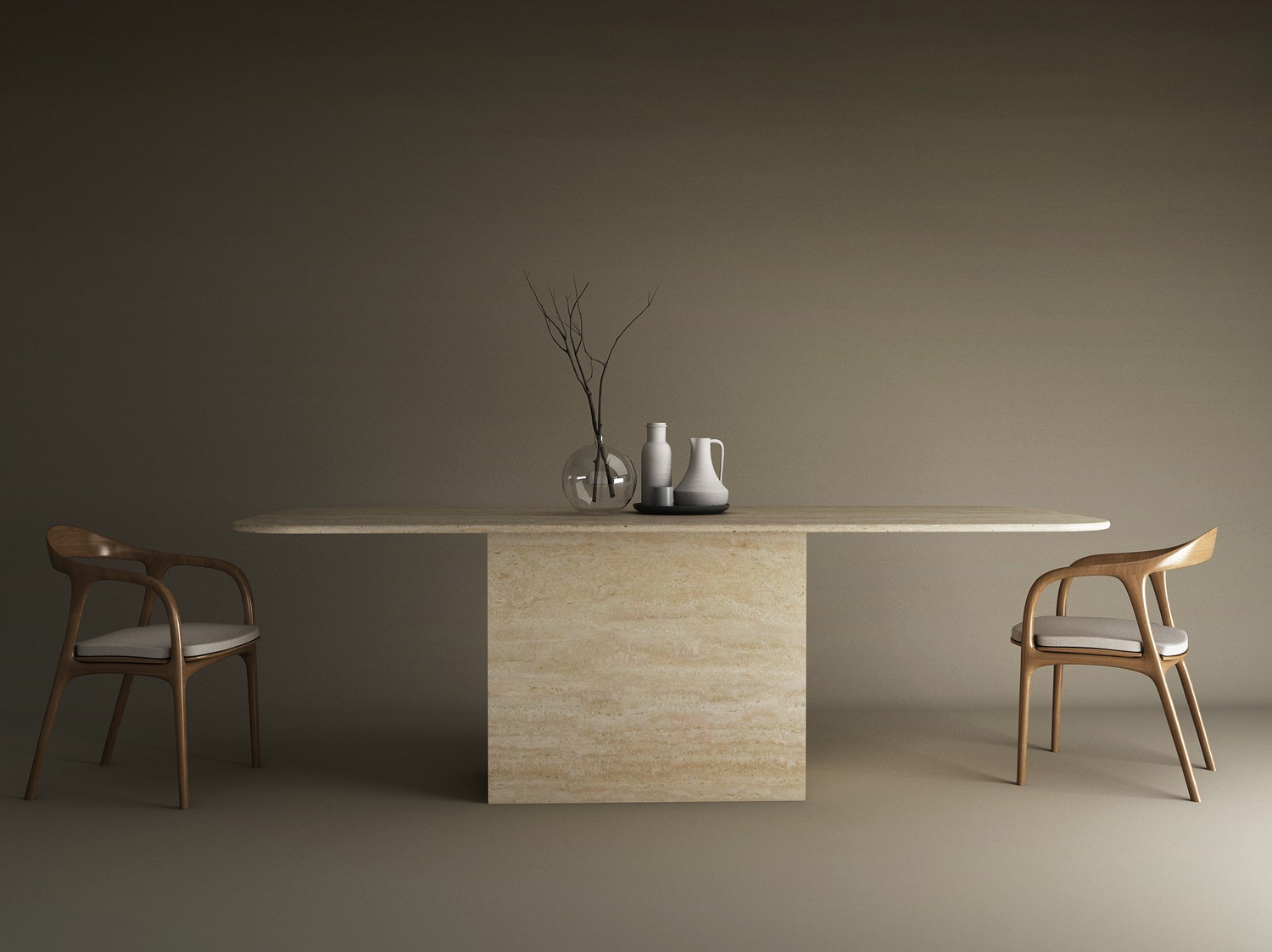 A minimalist dining setup features the TRAVERTABLE Rectangular Travertine Dining Table with Block Base, styled with a clear vase of branches and two white pitchers, flanked by two cushioned wooden chairs against a plain background.